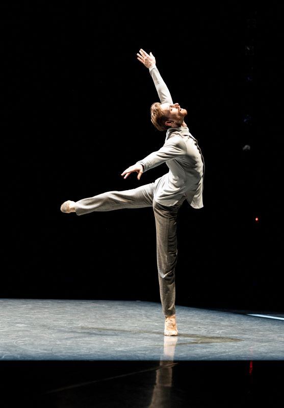 James Kirby Rogers performs in The Window, reaching expressivly up while in a low arabesque.
